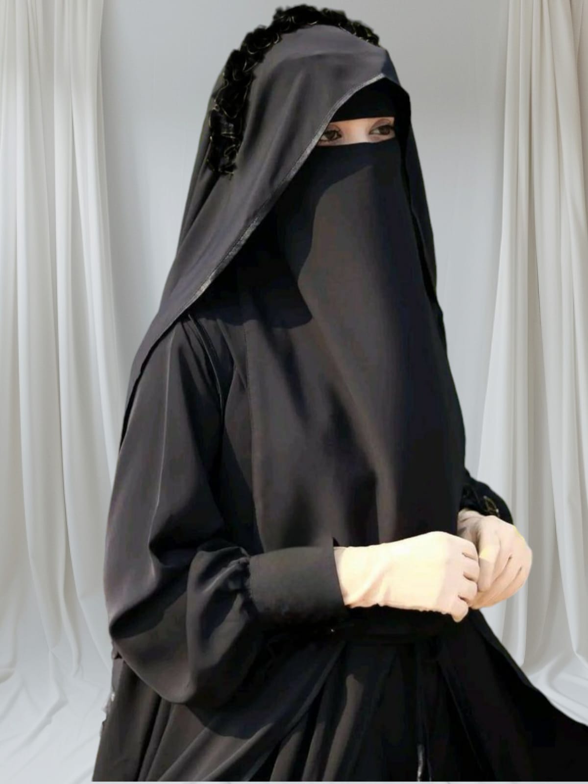 Exquisite Layered Ruffle Abaya inThis piece is beautifully crafted from premium imported